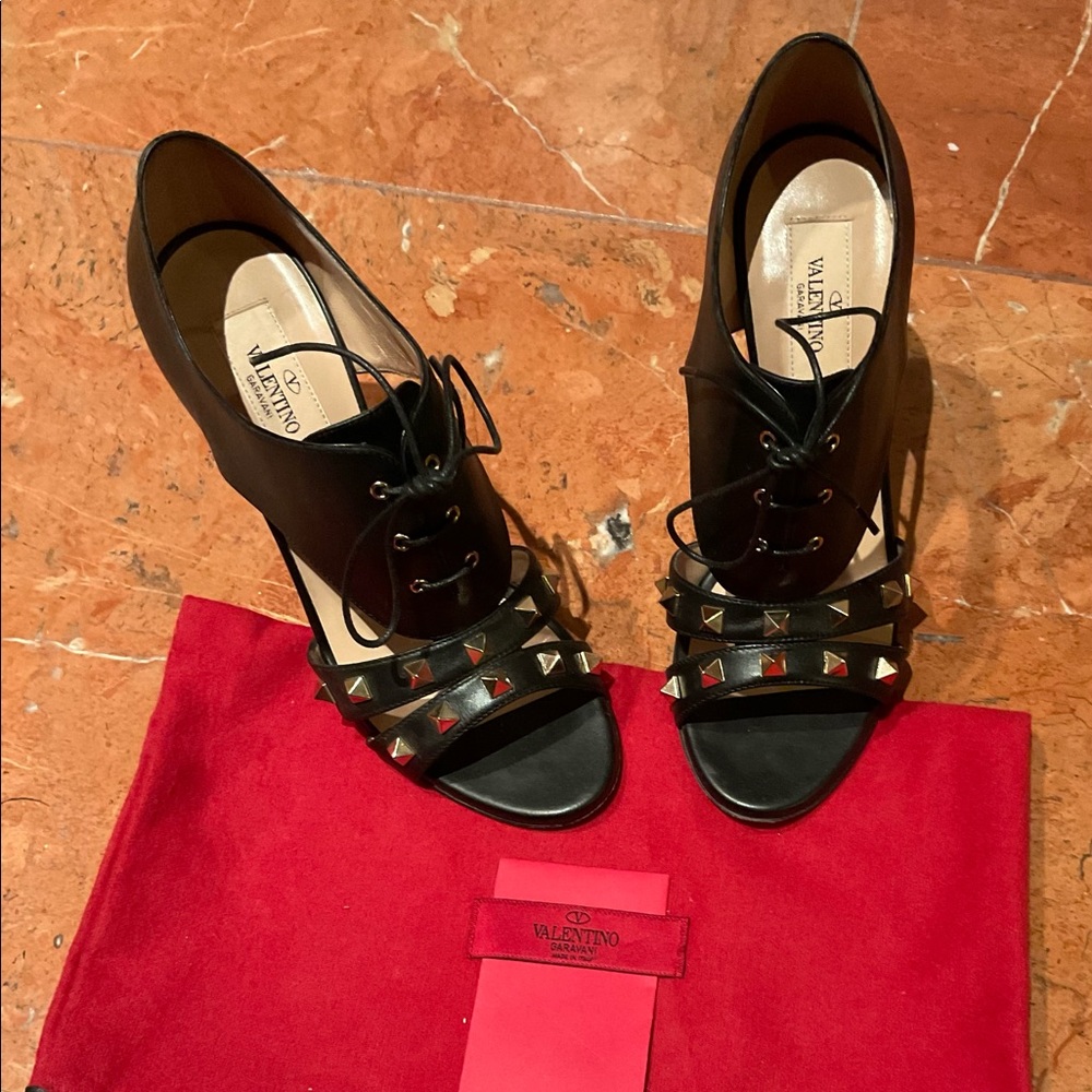 Valentino Garavani Black Leather Rockstud Open Toe Shoes.